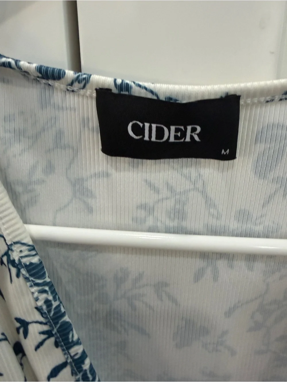 Cider White Romper with Navy Blue Floral Pattern - Picture 4 of 5